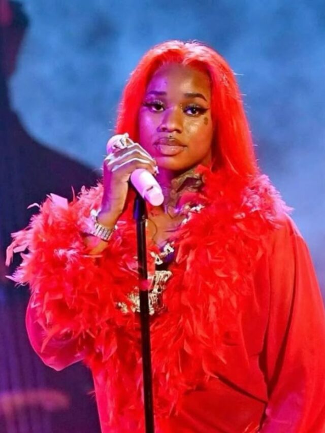 A confident, high-quality photo of Sexyy Red performing or posing with luxury styling, possibly holding a mic or wearing bold fashion.